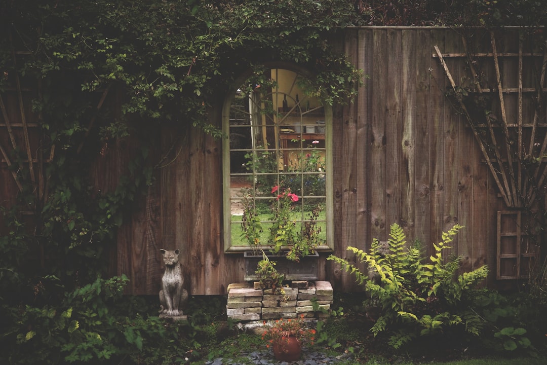 A picturesque English garden with colorful flowers and lush greenery.